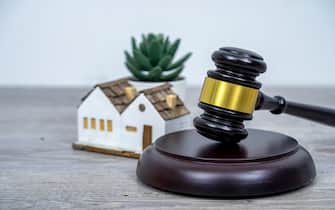 House with gavel. Real estate law and house auction concept.