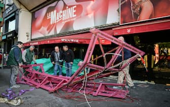 Workers remove the wings of the Moulin Rouge cabaret in Paris on April 25, 2024, after it collapsed last evening. The wings of the windmill on top of the famous Moulin Rouge cabaret fell off during the night on Wednesday the Paris fire department said. No injuries were reported, they said, adding that there was no longer any risk of further collapse. The reasons for the fall are currently unknown. It caused damage to the front of the cabaret, bringing down with it the first three letters of the illuminated sign. Images on social media showed the blade unit lying on the street below, with some of the blades slightly bent from the apparent fall. Photo by Firas Abdullah/ABACAPRESS.COM