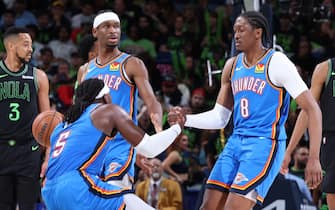 NEW ORLEANS, LA - APRIL 29: Luguentz Dort #5 of the Oklahoma City Thunder is helped up by Jalen Williams #8 and Shai Gilgeous-Alexander #2 during the game against the New Orleans Pelicans during Round 1 Game 4 of the 2024 NBA Playoffs on April 29, 2024 at the Smoothie King Center in New Orleans, Louisiana. NOTE TO USER: User expressly acknowledges and agrees that, by downloading and or using this Photograph, user is consenting to the terms and conditions of the Getty Images License Agreement. Mandatory Copyright Notice: Copyright 2024 NBAE (Photo by Jeff Haynes/NBAE via Getty Images)