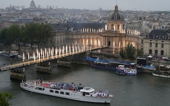 Delegations sail in a boat along the river Seine during the opening ceremony of the Paris 2024 Olympic Games in Paris on July 26, 2024. (Photo by Ricardo Mazalan / POOL / AFP) (Photo by RICARDO MAZALAN/POOL/AFP via Getty Images)