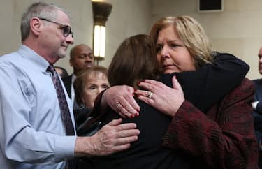 Mineola, N.Y.: On December 5, 2022, a Nassau County, New York, district attorney Ann Donnelly hugs Darlene Altman, whose mother, Diane Cusick, was killed by serial killer Richard Cottingham in 1968. Altman had made an impact statement inside the Nassau County Courthouse in Mineola, New York. Cottingham plead guilty to the slaying, and admitted to killing four other women, appearing virtually from a New Jersey prison. (Photo by James Carbone/Newsday RM via Getty Images)