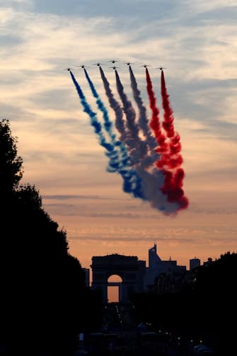 PARIS, FRANCE - AUGUST 28: The Patrouille acrobatique de France perform a flyby whilst releasing smoke in the colours of the French flag during the opening ceremony of the Paris 2024 Summer Paralympic Games at Place de la Concorde on August 28, 2024 in Paris, France. (Photo by Alex Davidson/Getty Images)