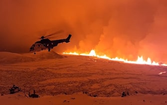 epa11036637 A handout photo made available by the Icelandic Coast Guard shows the crew of TF-EIR, a helicopter of the Coast Guard, that flew over a volcanic eruption to estimate its scale after an eruption began, north of Grindavik, on the Reykjanes peninsula, in Iceland, late 18 December 2023, (issued 19 December 2023). An evacuation order for the population of Grindavik was issued early this year on 10 November 2023 following seismic activity and indications of considerable magma movement in the area.  EPA/ICELANDIC COAST GUARD / HANDOUT BEST QUALITY AVAILABLE HANDOUT EDITORIAL USE ONLY/NO SALES HANDOUT EDITORIAL USE ONLY/NO SALES