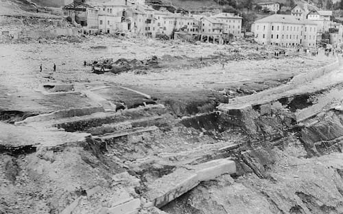 (Original Caption) Aerial view here October 10 shows aftermath of flooding of the 873-foot Vajont Dam the day before. A 300-foot wall of water, unleashed by a landslide, spilled over the dam, killing thousands of people and causing untold destruction.