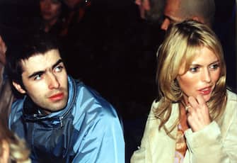 LONDON : 27/2/97 : LIAM GALLAGHER AND HIS FIANCEE PATSY KENSIT AFTER SHE MODELLED OUTFITS FROM THE BEN DE LISI COLLECTION AT LONDON FASHION WEEK. PA NEWS PHOTO BY NEIL MUNNS.   (Photo by Neil Munns - PA Images/PA Images via Getty Images)