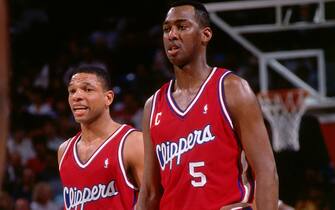 SACRAMENTO, CA - 1992:  Doc Rivers#25 and Danny Manning #5 of the Los Angeles Clippers during the game against the Sacramento Kings on March 10, 1992 at the Arco Arena, Sacramento, California. NOTE TO USER: User expressly acknowledges and agrees that, by downloading and or using this photograph, User is consenting to the terms and conditions of the Getty Images License Agreement. Mandatory Copyright Notice: Copyright 1992 NBAE (Photo by Rocky Widner/NBAE via Getty Images)