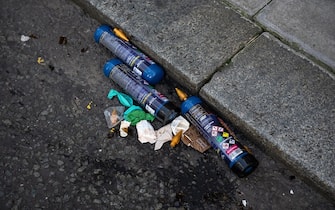 LONDON, ENGLAND - JANUARY 30: Cans of nitrous oxide, commonly known as laughing gas, lay in the gutter of a central London road on January 30, 2023 in London, England. The UK government is considering a ban on the sale of laughing gas in England and Wales amid concerns over damaging side effects and as part of a drive to tackle anti-social behaviour. Nitrous oxide is believed to be one of the most commonly used drugs among 16-24 year olds in England. (Photo by Carl Court/Getty Images)