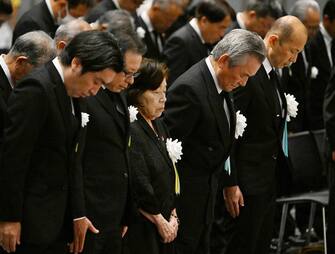 epa10791468 Takeko Kudo (C), 85, an A-bomb survivor having experienced the atomic bombing at the age of seven, offers a one minute silent prayer during a memorial service in Nagasaki, Nagasaki Prefecture, 09 August 2023, marking the 78th anniversary of the bombing. The cathedral canceled a night mass and Nagasaki City was forced to change the schedule of the memorial service for victims due to typhoon Khanun. Nagasaki City has announced the toll of victims from the atomic bombing rose to about 74,000. The figure was counted as the end of 1945 after the August 9 bombing.  EPA/JIJI PRESS JAPAN OUT EDITORIAL USE ONLY/