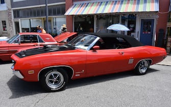 A 1970 Ford Torino GT 429 Cobra Jet on display at a car show.