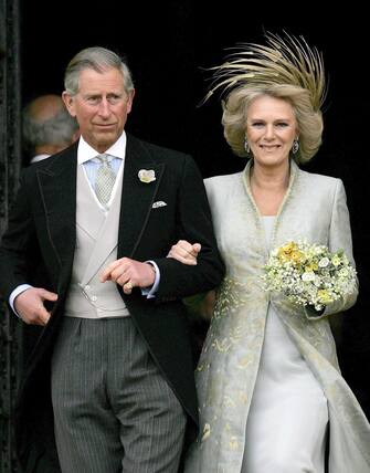 epa10610041 (FILE) - Britain's Prince Charles, the Prince of Wales, and Camilla, the Duchess of Cornwall, leave St George's Chapel following the blessing of their wedding, in Windsor, Britain, 09 April 2005 (reissued 05 May 2023). Britain's King Charles III's Coronation will take place at Westminster Abbey in London on 06 May 2023. The King will be crowned alongside Camilla, the Queen Consort.  EPA/ALASTAIR GRANT / POOL