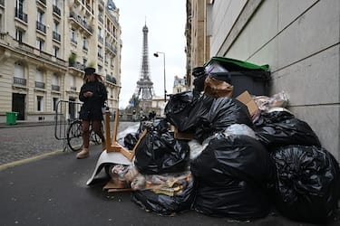 PARIS, FRANCE - MARCH 13: Garbage cans overflowing with trash on the streets as collectors go on strike in Paris, France on March 13, 2023. Garbage collectors have joined the massive strikes throughout France against pension reform plans. (Photo by Mustafa Yalcin/Anadolu Agency via Getty Images)