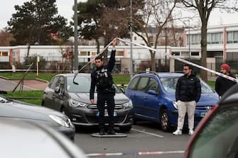 epa11044462 French police secure area in front of a building where five bodies were found dead in Meaux, near Paris, France, 26 December 2023. Five bodies, of a mother and her four children were found dead by French police in an apartment on the evening of 25 December. Jean-Baptiste Bladier, the local prosecutor confirmed that a homicide investigation has been launched after the five bodies were found.  EPA/Christophe Petit Tesson