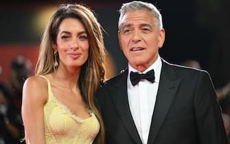 Actor George Clooney and his wife Amal Clooney attend the red carpet of the movie "Wolfs" presented out of competition during the 81st International Venice Film Festival at Venice Lido, on September 1, 2024. (Photo by Alberto PIZZOLI / AFP) (Photo by ALBERTO PIZZOLI/AFP via Getty Images)