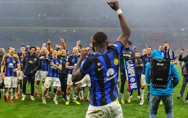 Marcus Thuram of FC Internazionale celebrates the victory of the Serie A 2023/24 title during Serie A 2023/24 football match between AC Milan and FC Internazionale at San Siro Stadium, Milan, Italy on April 22, 2024
