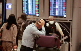 TEL AVIV, ISRAEL - APRIL 14: Passengers wait following Israel closed its airspace to all domestic and international flights between 01.00-07.00 a.m. were canceled after Iran launched the attack on Israel, at Ben Gurion airport in Tel Aviv, Israel on April 14, 2024. (Photo by Nir Keidar/Anadolu via Getty Images)