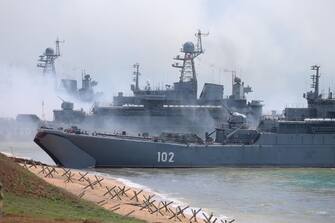 epa09152913 A handout photo made available by the press service of the Russian Defence Ministry shows Russian Navy Ropucha-class (Project 775) large landing ship Kaliningrad (front ) and Russian Navy major landing ship Korolyov (back) of the Baltic Fleet during the main stage of the mixed exercise of the Russian Armed Forces at the at Opuk range  in Crimea, 22 April 2021. Units of the combined arms army, air force and air defenÂ?e formations, warships and ships, military units of the coastal forces of the Black Sea Fleet, part of the forces of the Caspian Flotilla and airborne units take part in the military exercises at the Opuk training ground.  EPA/VADIM SAVITSKY / RUSSIAN DEFENCE MINISTRY / HANDOUT MANDATORY CREDIT / HANDOUT EDITORIAL USE ONLY/NO SALES