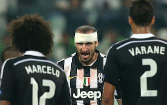 Juventus' defender Giorgio Chiellini (C) reacts during the UEFA Champions League semi-final first leg football match Juventus vs Real Madrid on May 5, 2015 at the Juventus stadium in Turin.     AFP PHOTO / MARCO BERTORELLO        (Photo credit should read MARCO BERTORELLO/AFP via Getty Images)