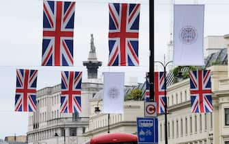 LONDON, UNITED KINGDOM - APR 26, 2023 - Coronation of King Charles III, flags on the Strand.