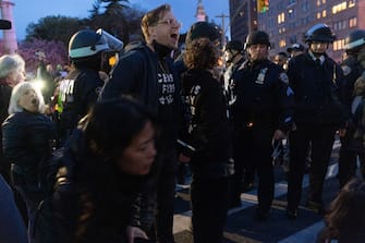 NEW YORK, NEW YORK - APRIL 23: Police detain protesters during a demonstration of the war in Gaza on April 23, 2024 in the Brooklyn borough of New York City. The event, which resulted in dozens of arrests, was held blocks from the residence of U.S. Sen. Chuck Schumer (D-NY). Schumer is a longtime supporter of Israel but has recently criticized President Benjamin Netanyahu for Israel's conduct in the war. (Photo by Andrew Lichtenstein/Corbis via Getty Images)