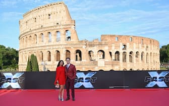 US wrestler and actor John Cena and his Iranian-born Canadian wife Shay Shariatzadeh arrive for the Premiere of the film "Fast X", the tenth film in the Fast & Furious Saga, on May 12, 2023 at the Colosseum monument in Rome. (Photo by Alberto PIZZOLI / AFP) (Photo by ALBERTO PIZZOLI/AFP via Getty Images)