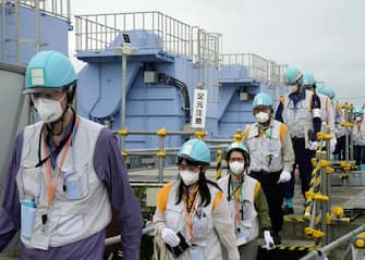 epa10760356 Journalists visit the facility for releasing the radioactive water treated by the Advanced Liquid Processing System (ALPS) into the sea at Tokyo Electric Power Company's (TEPCO) Fukushima Daiichi Nuclear Power Plant in Futaba, Fukushima Prefecture, northern Japan, 21 July 2023, to get hint when the TEPCO and Japanese government will start to release the radioactive water treated by the Advanced Liquid Processing System (ALPS) this summer. The nuclear power plant is located in tsunami-devastated towns of Okuma and Futaba.  EPA/KIMIMASA MAYAMA / POOL