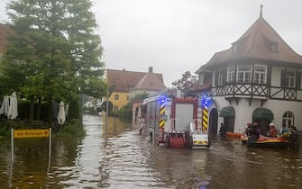 02 June 2024, Bavaria, Wertingen: Firefighters and water rescuers enter a flooded street with an inflatable boat. After the heavy rainfall of the last few days, there was severe flooding in the region. Photo: Stefan Puchner/dpa (Photo by Stefan Puchner/picture alliance via Getty Images)