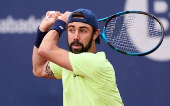 BARCELONA, SPAIN - APRIL 18: Jordan Thompson of Australia plays a backhand against Casper Ruud of Norway during their match of day four of the Barcelona Open Banc Sabadell at Real Club De Tenis Barcelona on April 18, 2024 in Barcelona, Spain.  (Photo by Alex Caparros/Getty Images)