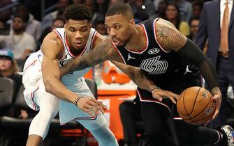 CHARLOTTE, NORTH CAROLINA - FEBRUARY 17: Damian Lillard #0 of the Portland Trail Blazers and Team LeBron drives against Giannis Antetokounmpo #34 of the Milwaukee Bucks and Team Giannis in the fourth quarter during the NBA All-Star game as part of the 2019 NBA All-Star Weekend at Spectrum Center on February 17, 2019 in Charlotte, North Carolina. Team LeBron won 178-164. NOTE TO USER: User expressly acknowledges and agrees that, by downloading and/or using this photograph, user is consenting to the terms and conditions of the Getty Images License Agreement.  (Photo by Streeter Lecka/Getty Images)