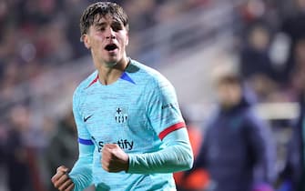 epa11027823 Marc Guiu of Barcelona celebrates after scoring his team's second goal during the UEFA Champions League group stage soccer match between Royal Antwerp and FC Barcelona, in Antwerp, Belgium, 13 December 2023.  EPA/OLIVIER MATTHYS