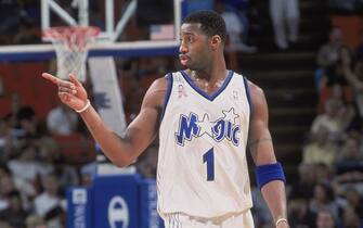 26 Nov 2001:  Forward Tracy McGrady #1 of the Orlando Magic walks down the court and points during the NBA game against the Detroit Pistons at the TD Waterhouse Centre in Orlando, Florida.  The Pistons defeated the Magic 105-100.  NOTE TO USER: User expressly acknowledges and agrees that, by downloading and/or using this Photograph, User is consenting to the terms and conditions of the Getty Images License Agreement. Mandatory copyright notice: Copyright 2001 NBAE Mandatory Credit: Fernando Medina /NBAE/Getty Images