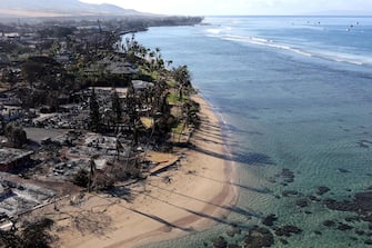 LAHAINA, HAWAII - AUGUST 11: In an aerial view, homes and businesses are seen that were destroyed by a wildfire on August 11, 2023 in Lahaina, Hawaii. Dozens of people were killed and thousands were displaced after a wind-driven wildfire devastated the town of Lahaina on Tuesday. Crews are continuing to search for missing people.   Justin Sullivan/Getty Images/AFP (Photo by JUSTIN SULLIVAN / GETTY IMAGES NORTH AMERICA / Getty Images via AFP)
