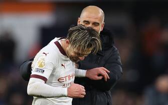 LUTON, ENGLAND - DECEMBER 10: Jack Grealish of Manchester City celebrates with Pep Guardiola after the Premier League match between Luton Town and Manchester City at Kenilworth Road on December 10, 2023 in Luton, England. (Photo by Marc Atkins/Getty Images)