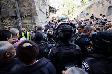 JERUSALEM - APRIL 29: Israeli forces raid Masjid al-Aqsa in the Old City of East Jerusalem on April 29, 2022. The Israeli police, who removed Palestinians in the courtyard of al-Aqsa Mosque, closed the doors of the Masjid al-Aqsa to Muslims coming from outside for the last Friday prayer of Ramadan. (Photo by Mostafa Alkharouf/Anadolu Agency via Getty Images)