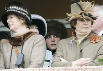 CHELTENHAM, ENGLAND - MARCH 17:  Prince William's girlfriend, Kate Middleton discreetly stands at the back of the royal box to watch the Cheltenham Races on March 17, 2006 in Cheltenham, England. (Photo by Tim Graham Photo Library via Getty Images) 
