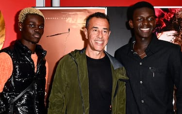 TURIN, ITALY - OCTOBER 3: (L-R) Actor Moustapha Fall, Italian director Matteo Garrone and Musician Seydou Sarr  attends during "Io, Capitano" Photocall on October 3, 2023 in Turin, Italy. (Photo by Stefano Guidi/Getty Images)