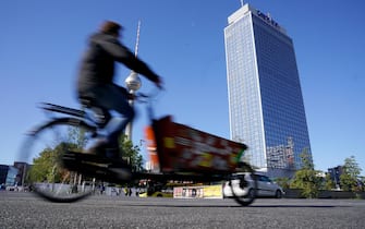 epa07860489 A cyclist rides a cargo bike near the TV tower during the Car-Free Day in Berlin, Germany, 22 September 2019. During the 18th edition of EUROPEANMOBILITYWEEK, the European Commissionâs flagship campaign promotioned clean and sustainable urban transport. Running from 16-22 September 2019, almost 3,000 towns and cities from about 50 countries joined with their activities promoting safe walking and cycling. EUROPEAN MOBILITY WEEK culminates each year in the Car-Free Day, when streets close for traffic and open for people.  EPA/ALEXANDER BECHER