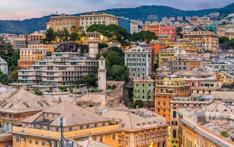 Genova, Italy city skyline view towards the historic belvedere castelletto at twilight.