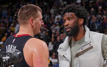 DENVER, CO - JANUARY 27: Joel Embiid #21 of the Philadelphia 76ers and Nikola Jokic #15 of the Denver Nuggets embrace after the game on January 27, 2024 at the Ball Arena in Denver, Colorado. NOTE TO USER: User expressly acknowledges and agrees that, by downloading and/or using this Photograph, user is consenting to the terms and conditions of the Getty Images License Agreement. Mandatory Copyright Notice: Copyright 2024 NBAE (Photo by Bart Young/NBAE via Getty Images)