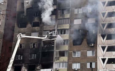 KYIV, UKRAINE - FEBRUARY 7, 2024 - Firefighters put out a fire in a block of flats in the Holosiivskyi district hit by falling Russian missile debris after the Russian attack on Wednesday morning, Kyiv.  (Photo credit should read Eugen Kotenko / Ukrinform/Future Publishing via Getty Images)