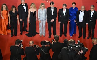 TOPSHOT - (From 4thL) Czech-Italian actress Barbora Bobulova, Italian actress Margherita Buy, Italian director Nanni Moretti, French actor Mathieu Amalric and guests arrive for the screening of the film "Il Sol Dell'Avvenire" (A Brighter Tomorrow) during the 76th edition of the Cannes Film Festival in Cannes, southern France, on May 24, 2023. (Photo by Antonin THUILLIER / AFP) (Photo by ANTONIN THUILLIER/AFP via Getty Images)