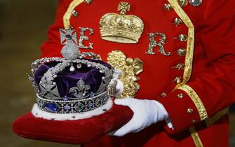 The Imperial State Crown is carried on a cushion as it arrives for the State Opening of Parliament, at the Houses of Parliament in London.