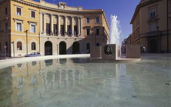 Fountain, 1929, Piazza Fratelli Rosselli or Piazza della Vasca, in the background the Government Building, 1922-1927, Grosseto, Tuscany, Italy, 20th century.