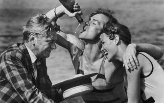 Seymour Cassel as George Ullman, Russian ballet dancer Rudolf Nureyev (1938 - 1993) as the eponymous actor, and pop singer Michelle Phillips as Natasha Rambova in the film 'Valentino', a biopic of silent screen idol Rudolph Valentino, 1977. (Photo by Archive Photos/Getty Images)