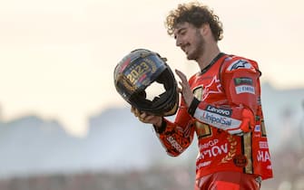 epa10996336 Italian MotoGP rider Francesco Bagnaia of Ducati Lenovo celebrates becoming World Champion after his win in the motorcycling Grand Prix of Valencia at Ricardo Tormo circuit in Cheste, Valencia, Spain, 26 November 2023.  EPA/BIEL ALINO