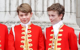 LONDON, UNITED KINGDOM - MAY 06: (EMBARGOED FOR PUBLICATION IN UK NEWSPAPERS UNTIL 24 HOURS AFTER CREATE DATE AND TIME) Prince George of Wales (in his role as Page of Honour) and Page of Honour Lord Oliver Cholmondeley watch an RAF flypast from the balcony of Buckingham Palace following the Coronation of King Charles III & Queen Camilla at Westminster Abbey on May 6, 2023 in London, England. The Coronation of Charles III and his wife, Camilla, as King and Queen of the United Kingdom of Great Britain and Northern Ireland, and the other Commonwealth realms takes place at Westminster Abbey today. Charles acceded to the throne on 8 September 2022, upon the death of his mother, Elizabeth II. (Photo by Max Mumby/Indigo/Getty Images)