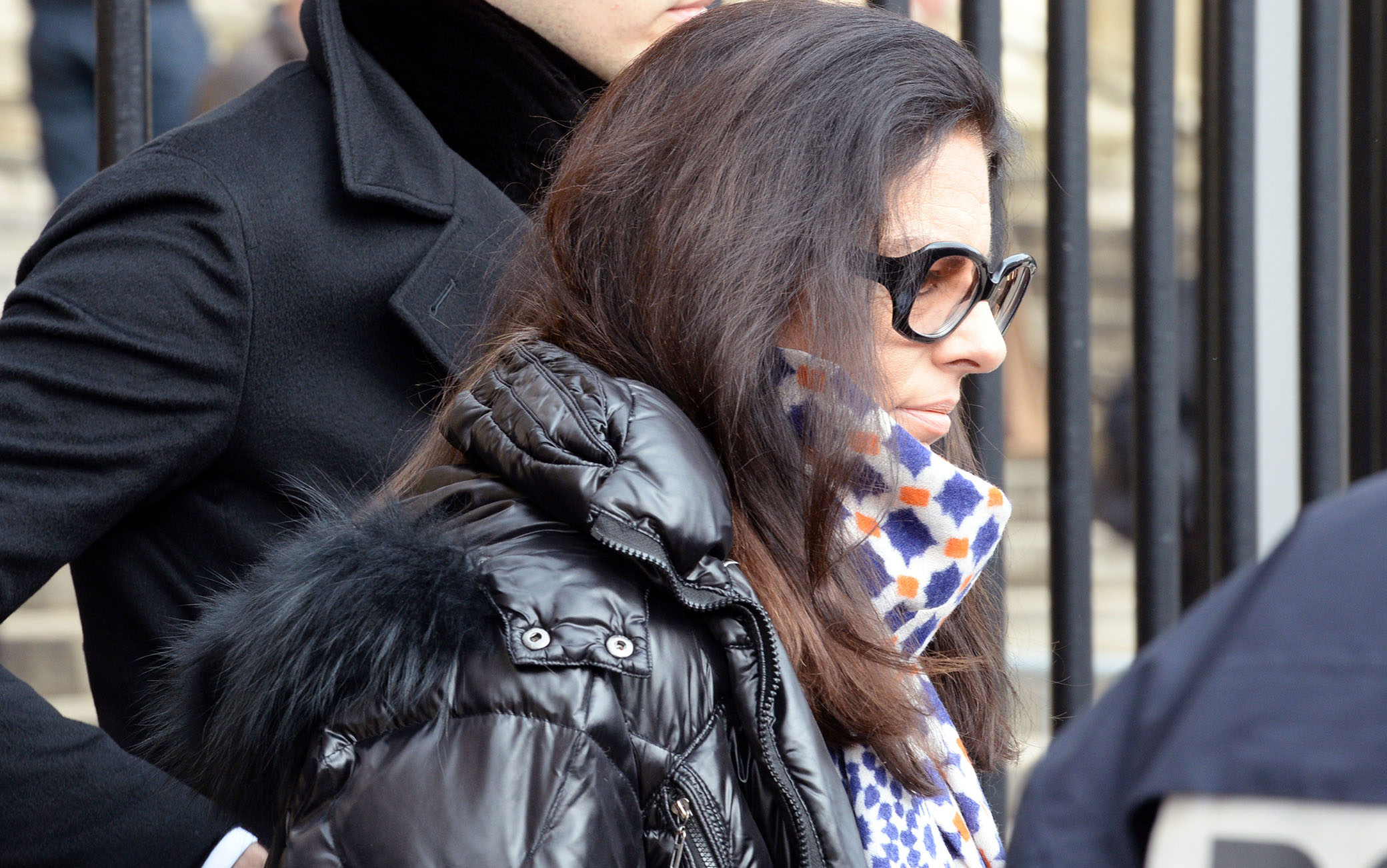 Francoise Bettencourt-Meyers, daughter of France's richest woman Liliane Bettencourt, and her son Victor (L) leave the courthouse of Bordeaux, southwestern France, on February 17, 2015 during the trial of ten people charged with exploiting elderly L'Oreal heiress and France's richest woman Liliane Bettencourt. Ten members of Bettencourt's entourage are accused of taking advantage of the 92-year-old billionaire's growing mental fragility in an explosive legal and political drama. AFP PHOTO / JEAN-PIERRE MULLER        (Photo credit should read JEAN-PIERRE MULLER/AFP via Getty Images)