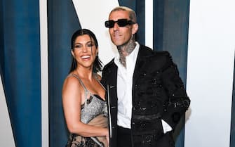 Kourtney Kardashian and Travis Barker walking on the red carpet at the 2022 Vanity Fair Oscar Party held at the Wallis Annenberg Center for the Performing Arts in Beverly Hills, CA on March 27, 2022. (Photo by Anthony Behar/Sipa USA)