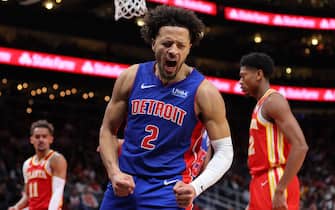 ATLANTA, GEORGIA - DECEMBER 18:  Cade Cunningham #2 of the Detroit Pistons reacts as he draws a foul after dunking against Trae Young #11 of the Atlanta Hawks during the fourth quarter at State Farm Arena on December 18, 2023 in Atlanta, Georgia.  NOTE TO USER: User expressly acknowledges and agrees that, by downloading and/or using this photograph, user is consenting to the terms and conditions of the Getty Images License Agreement.  (Photo by Kevin C. Cox/Getty Images)