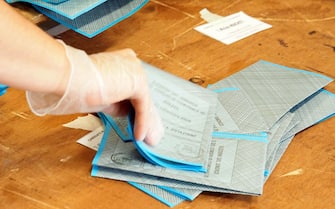 Italy, Arezzo, september 22, 2020 : Counting the ballots of municipal elections. Counting is taking place with security measures to avoid contracting