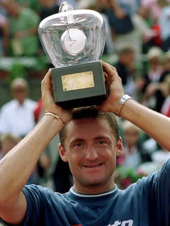 STO01-20010715, STOCKHOLM, SWEDEN: Italian player Andrea Gaudenzi poses with his trophy after winning the Men's Single Final against Czech player Bohdan Ulihrach at the Swedish Open in Bastad, Sunday 15 July 2001. Gaudenzi won 7-5, 6-3.
EPA PHOTO/PRESSENS BILD/ARNE FORSELL